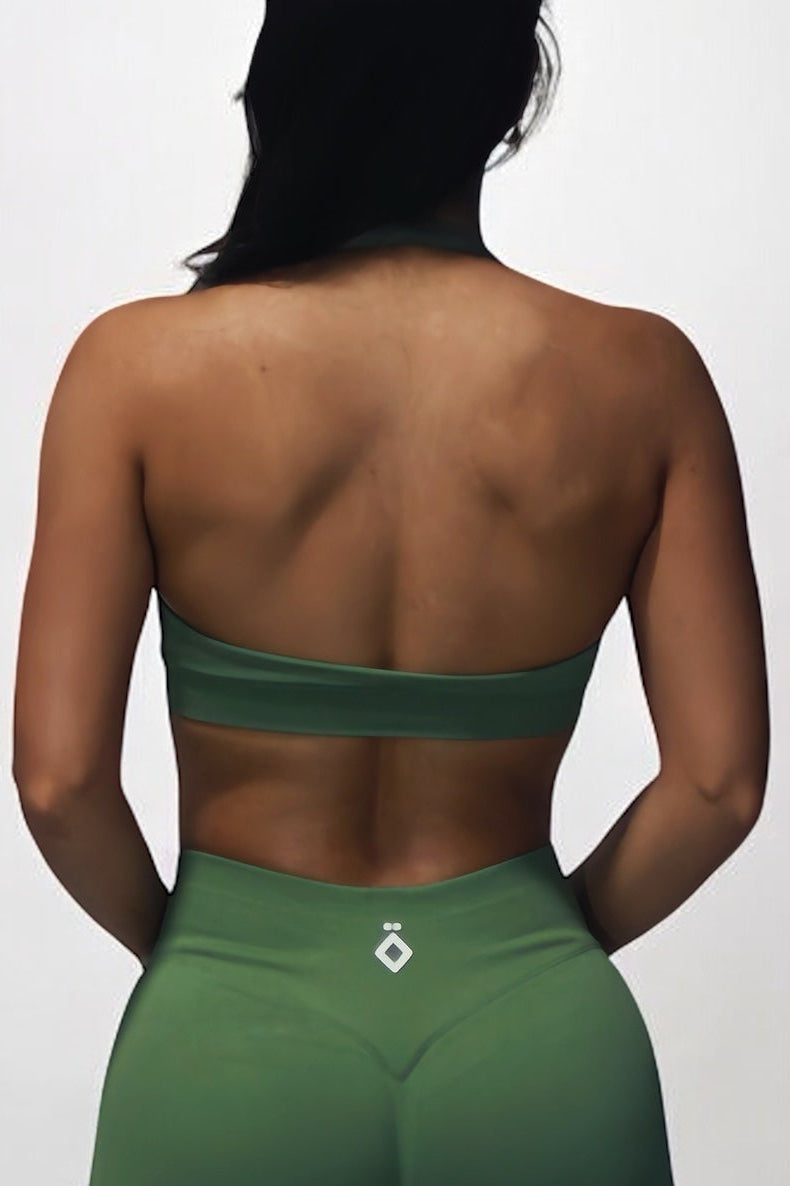 Person wearing a green sports outfit on a white background