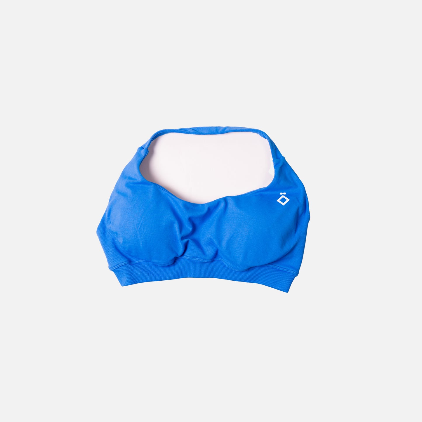 Blue sports bra on a light gray background