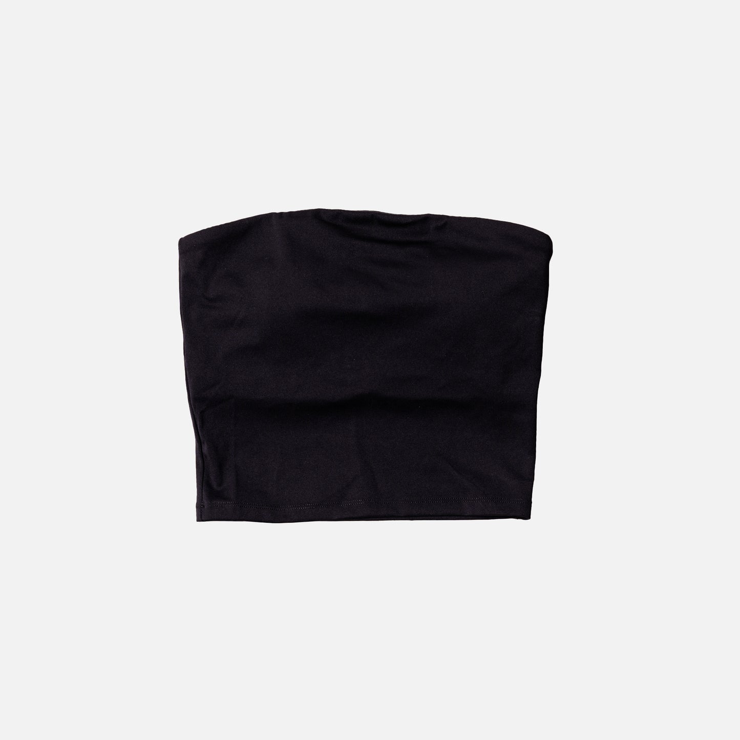 Black tube top activewear on a light gray background