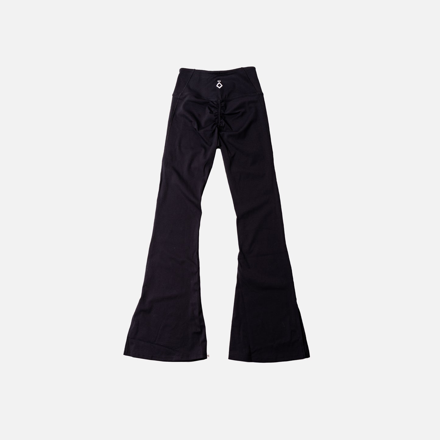 Black flare leggings on a light gray background