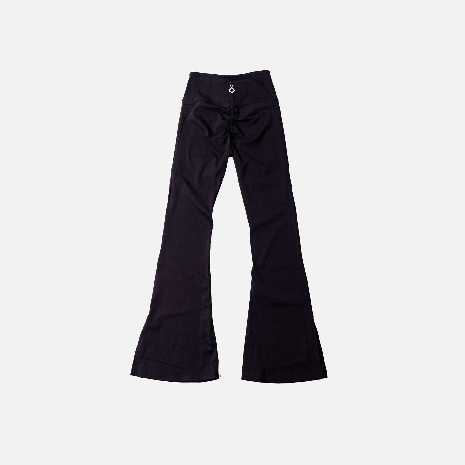 Black flare leggings on a light gray background