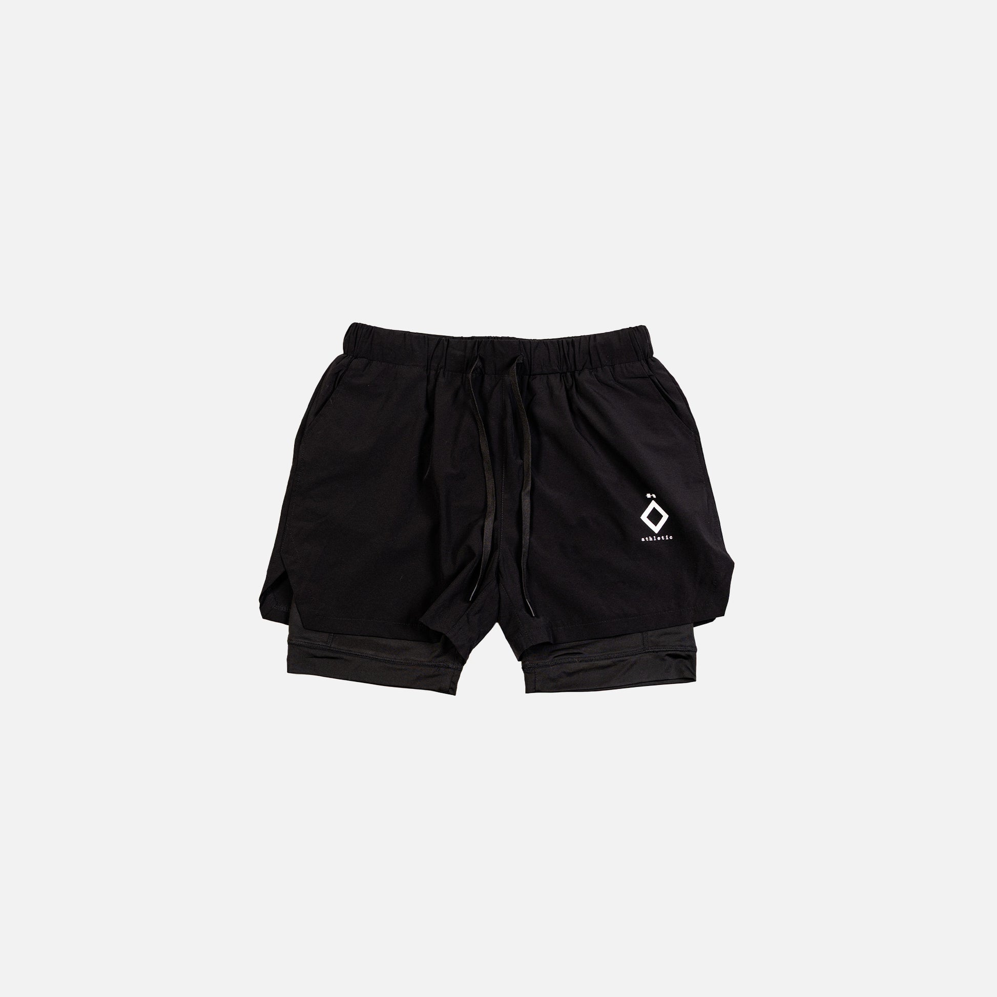 A pair of black athletic shorts with a small white logo on the left leg, viewed from the front.