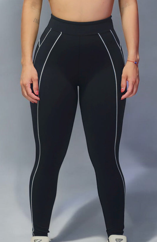woman wearing a black sports bra with white lines